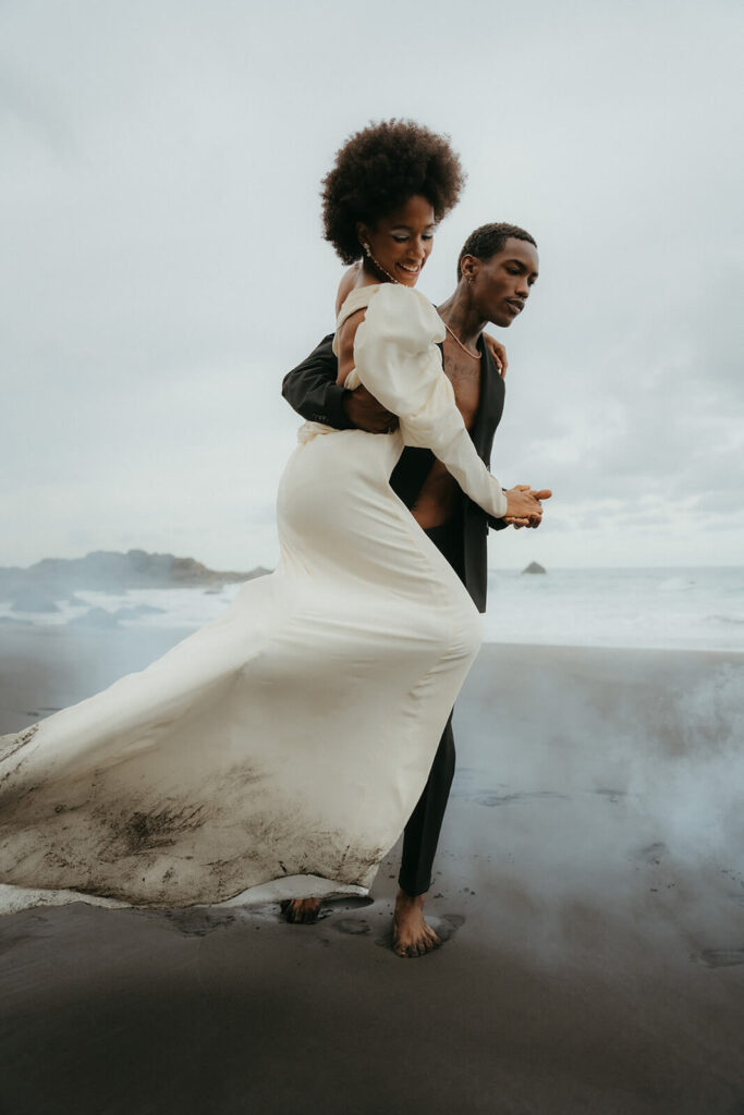 L'eto bridal silk dress worn by a modern bride who got married in Tenerife, Spain on the black sand beach.