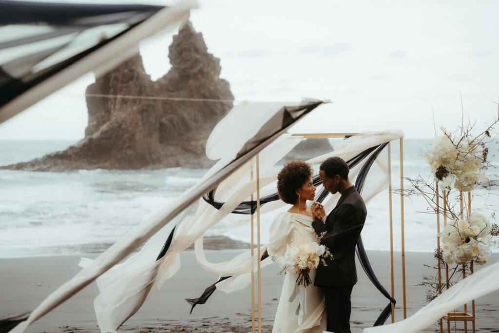 L'eto bridal silk dress worn by a modern bride who got married in Tenerife, Spain on the black sand beach.